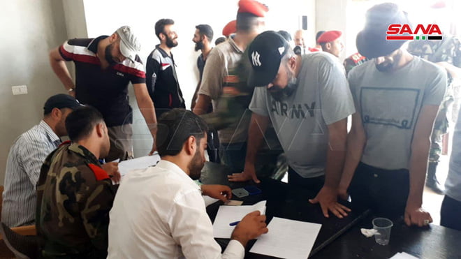 تسوية أوضاع عدد من المسلحين في درعا